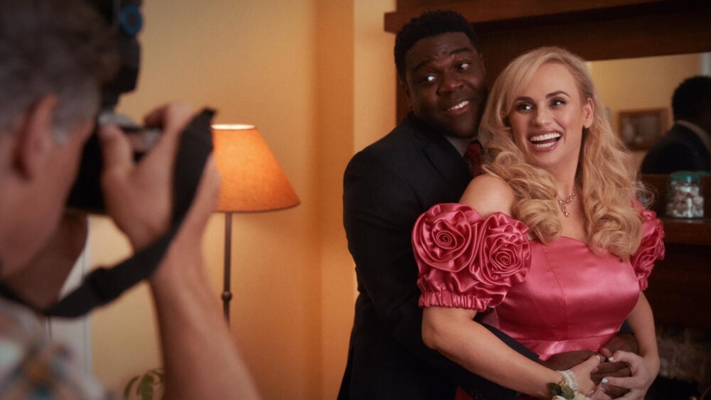 Senior Year characters Stephanie and Seth played by Rebel Wilson and Sam Richardson pose for a prom photo