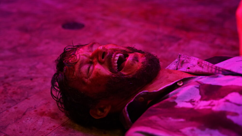 Wes lays on the ground in Glorious